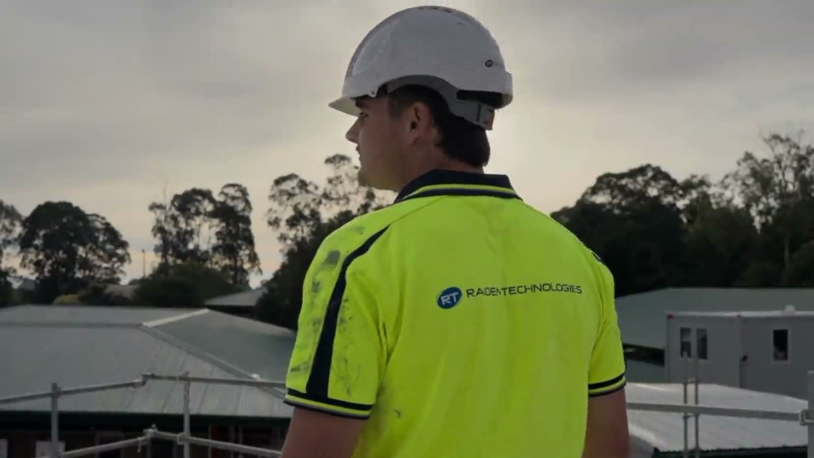 Commercial security technician installing CCTV on a building for Raiden Technologies