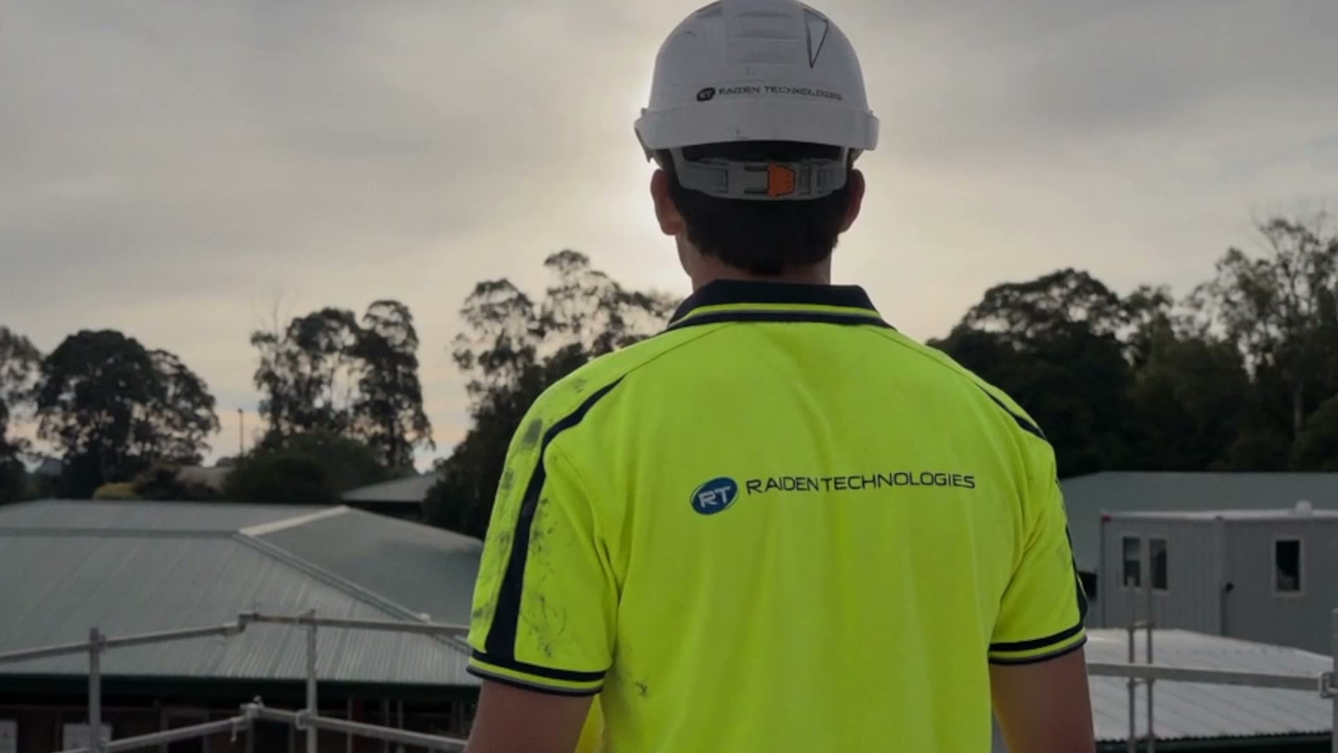 Commercial security technician installing CCTV on a building for Raiden Technologies