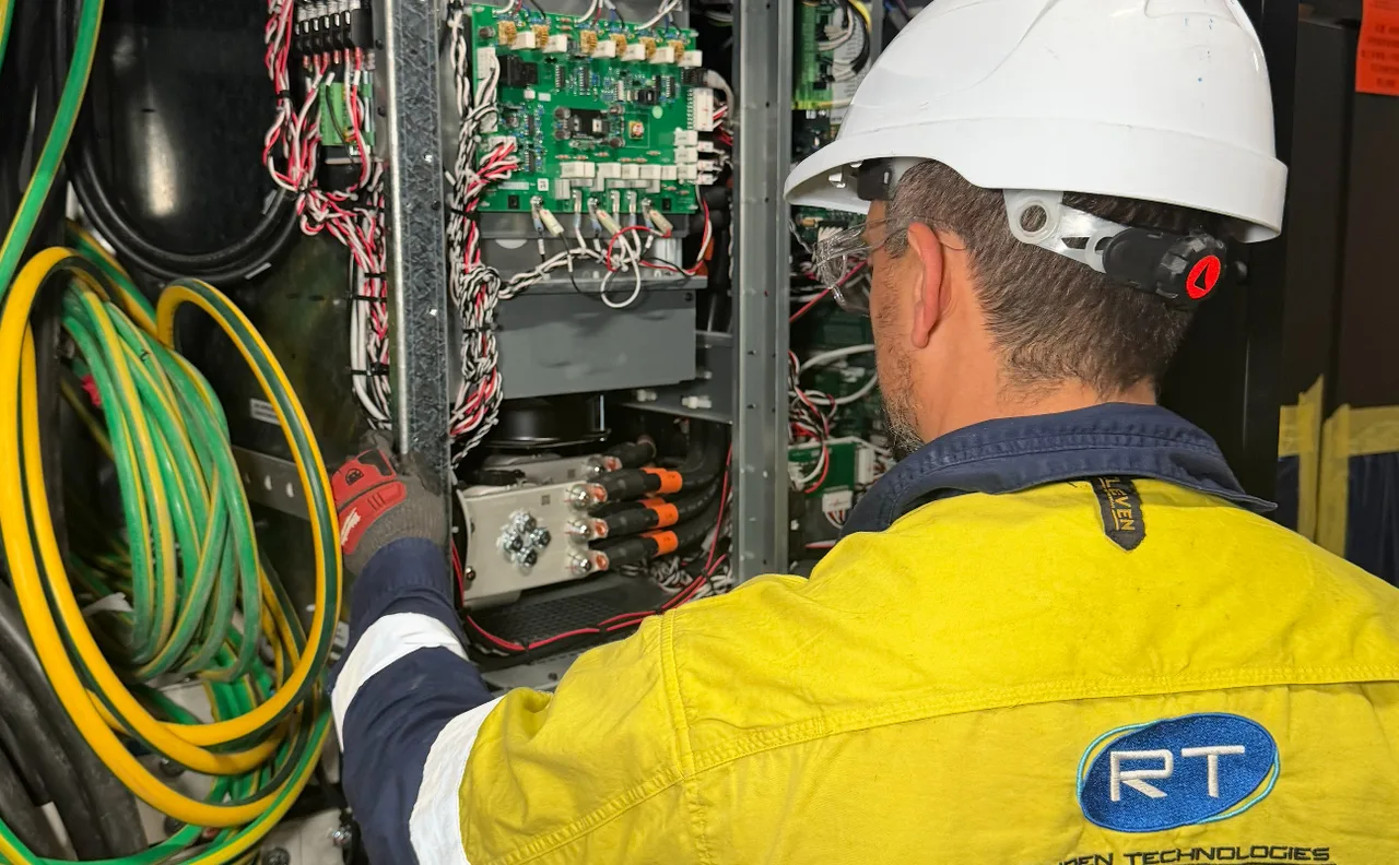 Raiden Technologies licensed technician working on commercial electrical and security infrastructure